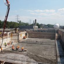 Pump truck pouring concrete slab foundations
