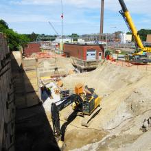 Excavating around shoring system