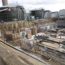 Overview of concrete works being poured by pump truck