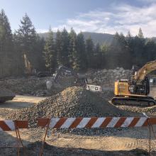 Excavators completing earthworks around site