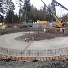 Concrete pump truck pouring a circular slab
