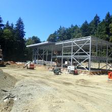 Structural steel and metal deck framework shown for building